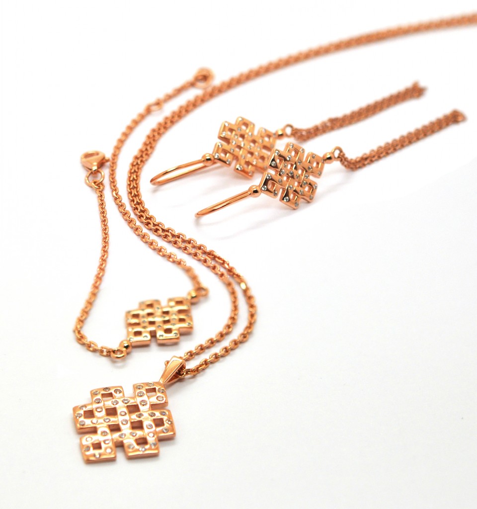 Entwine rose gold The Entwine earrings, necklace and bracelet in pink gold.